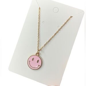 Pink and gold smiley face necklace